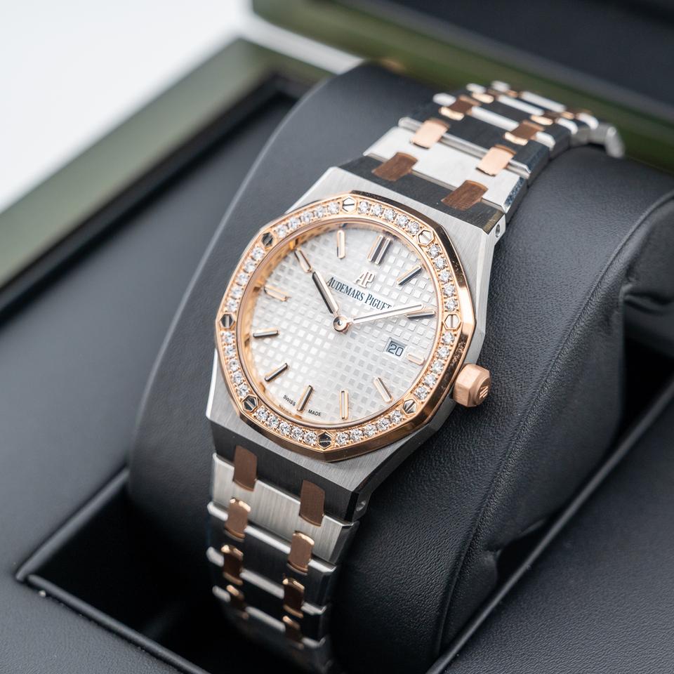 Audemars Piguet Royal Oak
Silver toned Dial Steel and Gold Diamond Bezel 33mm