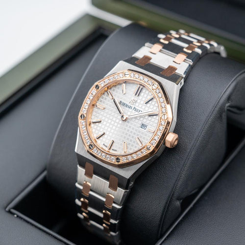 Audemars Piguet Royal Oak
Silver toned Dial Steel and Gold Diamond Bezel 33mm