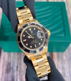 Rolex Submariner gold and black